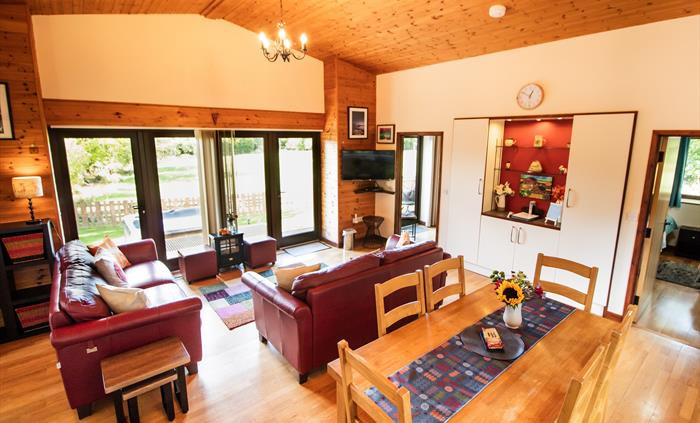 Lounge area with smart TV and a view across the countryside.